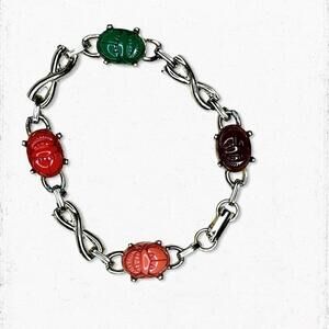 796gc. Goldtone Egyptian Revival Plastic Scarab Bracelet